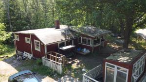 an aerial view of a red house in the woods at Boamark Sweden in Mörrum