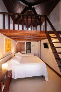 Cama ou camas em um quarto em Hotel Pousada Coqueiros mais 37 fotos