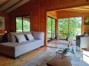 a living room with a couch and a table at Raki Bed and Breakfast Hostel in Trape