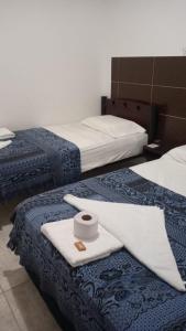 Postel nebo postele na pokoji v ubytování AVENTURa HOTEL