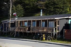 a train car sitting on the side of a street at Refugio Jemmy Button in Puerto Williams