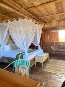 Postel nebo postele na pokoji v ubytování Palaa Mayapo Ecolodge