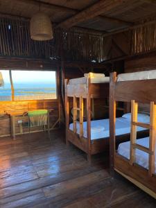 Postel nebo postele na pokoji v ubytování Palaa Mayapo Ecolodge