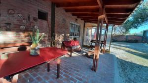 a person sitting in a chair in a living room at Punta del Sur in San Clemente del Tuyú
