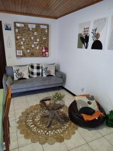 a living room with a couch and a table at Marques House in Machico