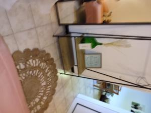 a refrigerator with a fan in a room at Marques House in Machico