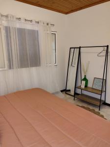 a bedroom with a bed and a window at Marques House in Machico