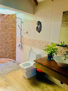 a bathroom with a toilet and a sink at Rimaka Village - Tourist Board Approved Hotel in Habarana +87 photos