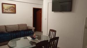 a living room with a glass table and chairs at Perfect Place 3 - Djenovici in Đenovići