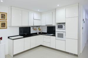 Η κουζίνα ή μικρή κουζίνα στο Casa kretcheu Mindelo +16 φωτογραφίες