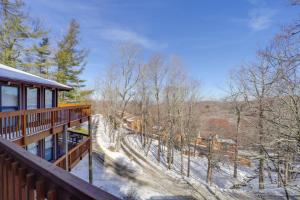 a balcony of a house with snow on the ground at Ski, Hike & More! Couple's Getaway in Beech Mtn in Beech Mountain