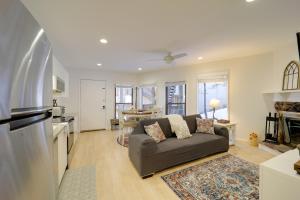 a living room with a couch and a kitchen at Ski, Hike & More! Couple's Getaway in Beech Mtn in Beech Mountain