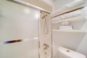 a white bathroom with a shower and a toilet at Ski, Hike & More! Couple's Getaway in Beech Mtn in Beech Mountain +17 photos