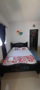 Postel nebo postele na pokoji v ubytování Caribe Sunshine Gold Hostel 1 habitacion
