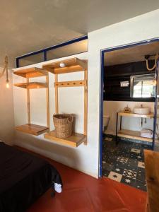 a room with a bathroom with a sink and a toilet at Los Cruxes in Tepoztlán