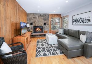 a living room with a couch and a fireplace at 4479 Timber Falls 2001 in Vail
