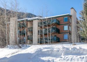 a building with snow in front of it at 4479 Timber Falls 2001 in Vail