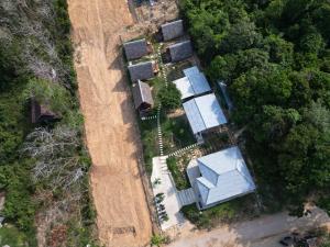 an overhead view of a farm with a field at Phu Aunna in Ko Phayam