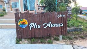 a wooden fence with a sign for a villa at Phu Aunna in Ko Phayam
