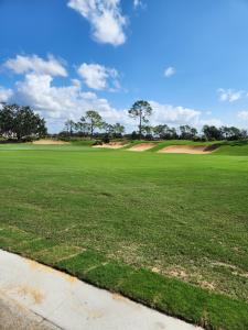 a view of a golf course with a green field at D&T Flamingo Paradise in Haines City
