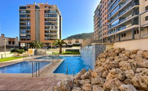 Swimmingpoolen hos eller tæt på TorreAguiló Urbanización con Piscina Gym y Padel