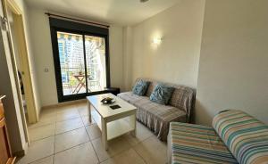 Et opholdsområde på TorreAguiló Urbanización con Piscina Gym y Padel + 58 billeder