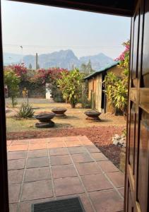 a view of a garden from the door of a house at Los Cruxes in Tepoztlán