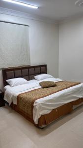 Ένα ή περισσότερα κρεβάτια σε δωμάτιο στο شقق زد السكنية