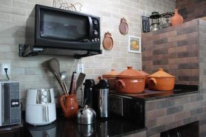 Kuchyň nebo kuchyňský kout v ubytování Casa Estilo Loft e Espaco Gourmet aconchegante + 12 fotografií