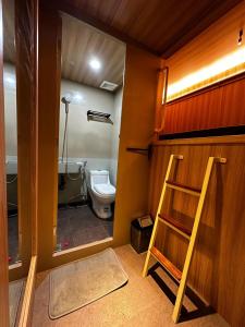 Postel nebo postele na pokoji v ubytování Dosare Capsule Hotel