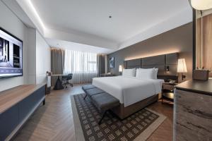 广州荔湾城际酒店 LntercityHotel Guangzhou Liwan客房内的一张或多张床位