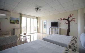 A bed or beds in a room at 蘭陽橋民宿