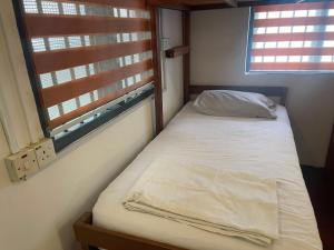 Postel nebo postele na pokoji v ubytování Voyage Guesthouse