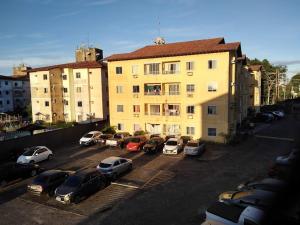 a group of cars parked in a parking lot in front of a building at Cop 30 apartamento compartilhado in Ananindeua
