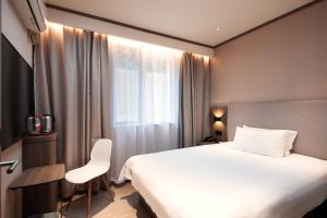 Televiisor ja/või meelelahutuskeskus majutusasutuses Hanting Hotel Shanghai Lujiazui Pudong South Road