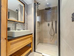 a bathroom with a sink and a shower at Appartement 3 chambres à Méribel, service 5* - FR-1-613-138 in Les Allues
