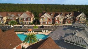 an aerial view of a house with a swimming pool at Disney here we go in Orlando