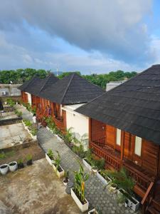 an overhead view of a row of houses with roofs at Amore in Labuan Bajo
