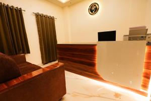 a conference room with a desk and a podium at Hotel RJ in Patna