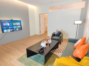 a living room with a couch and a coffee table at The Tranquil - Bangsar Trade Centre in Kuala Lumpur