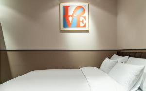 Postel nebo postele na pokoji v ubytování Incheon Browndot Hotel Nonhyeon Soraepogu