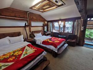 Lijiang Ancient Town Taohua Island Viewing Station房間的床