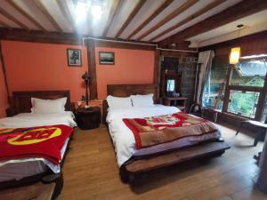 Lijiang Ancient Town Taohua Island Viewing Station房間的床