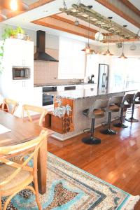 a kitchen with a table and chairs in a room at Sherwood Park in Spring Terrace