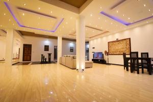 a large living room with a couch and a table at Imon Lanka Beach Hotel in Matara