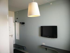 TV a/nebo společenská místnost v ubytování Motel X