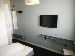 TV a/nebo společenská místnost v ubytování Motel X