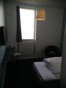 Postel nebo postele na pokoji v ubytování Motel X