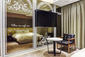 En eller flere senger på et rom på Hotel The Class