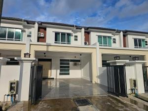 a large white house with a driveway at Cahaya Villa 2452 in Miri